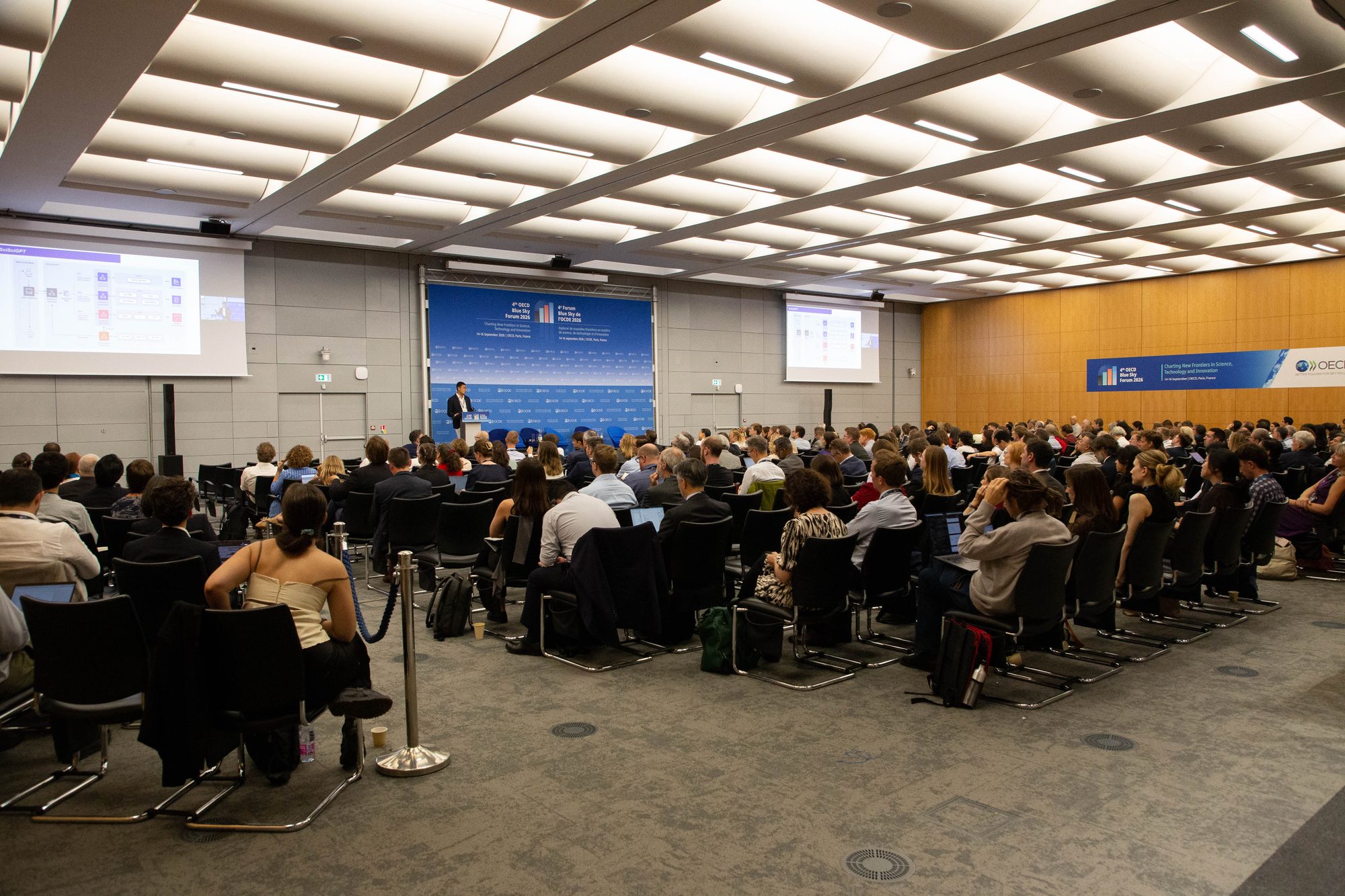 Audience in a large conference room at the OECD Conference Centre during a plenary session of the Blue Sky Forum 2026